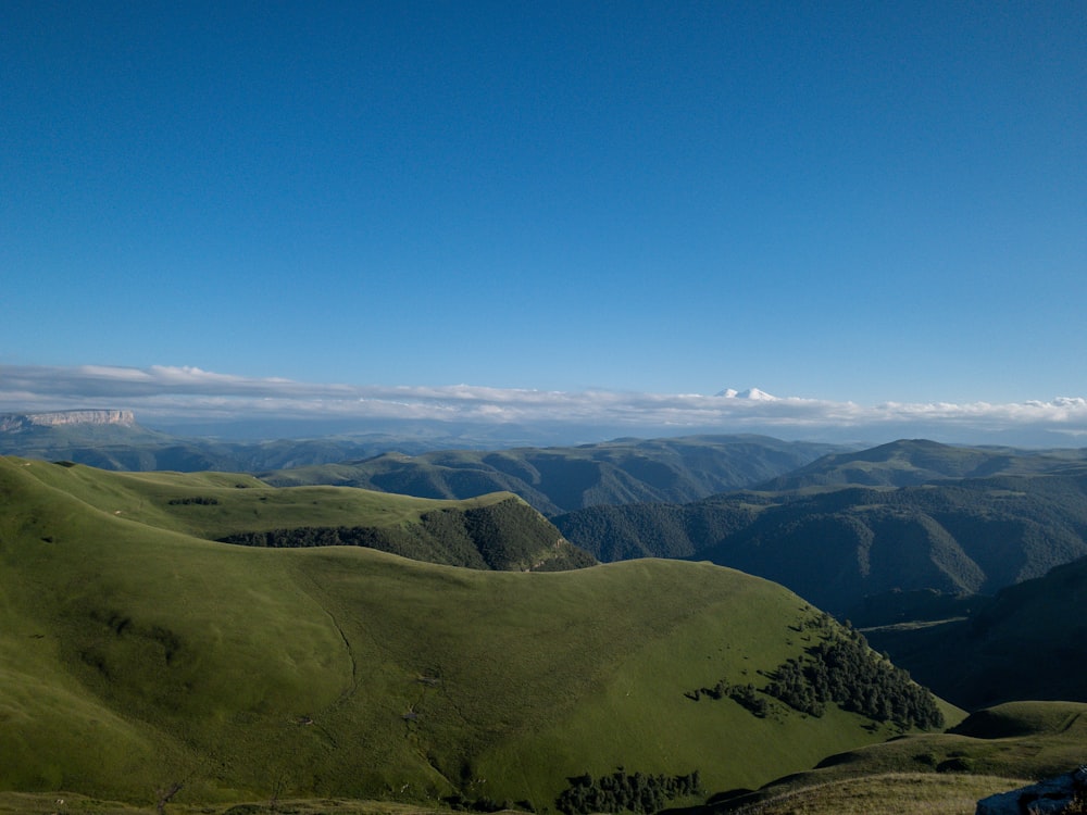 green and brown mountains under blue sky during daytime