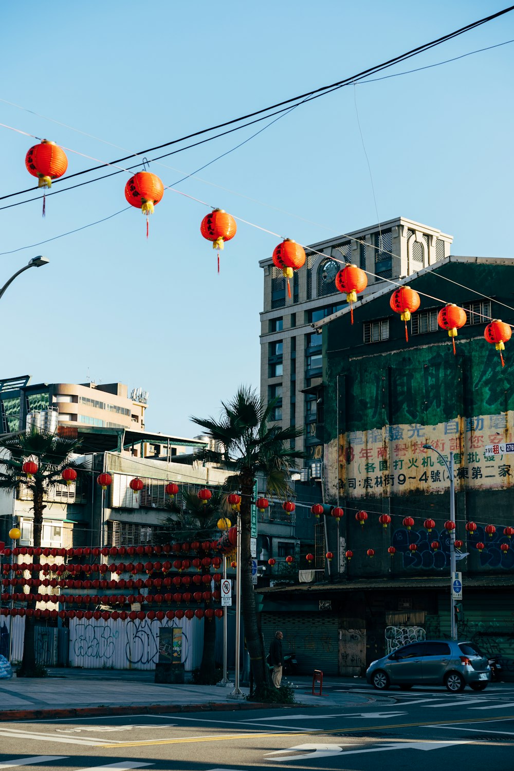 red and orange lanterns on street during daytime