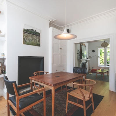 brown wooden table and chairs