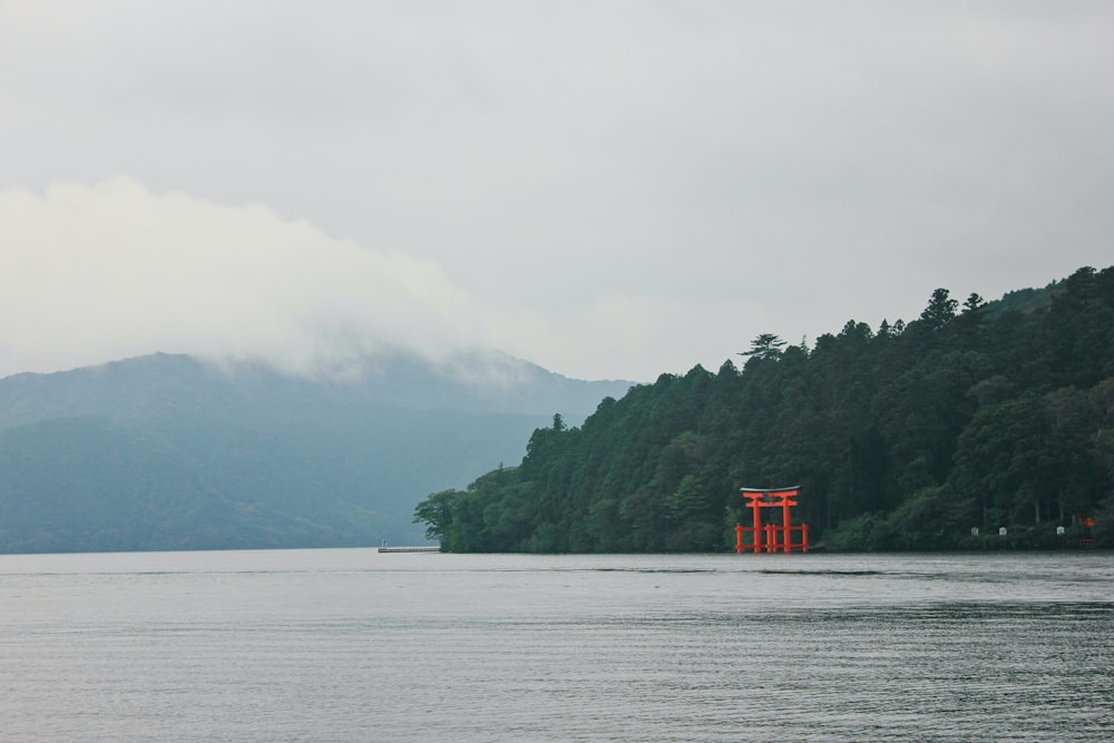 red and white wooden dock on lake during daytime