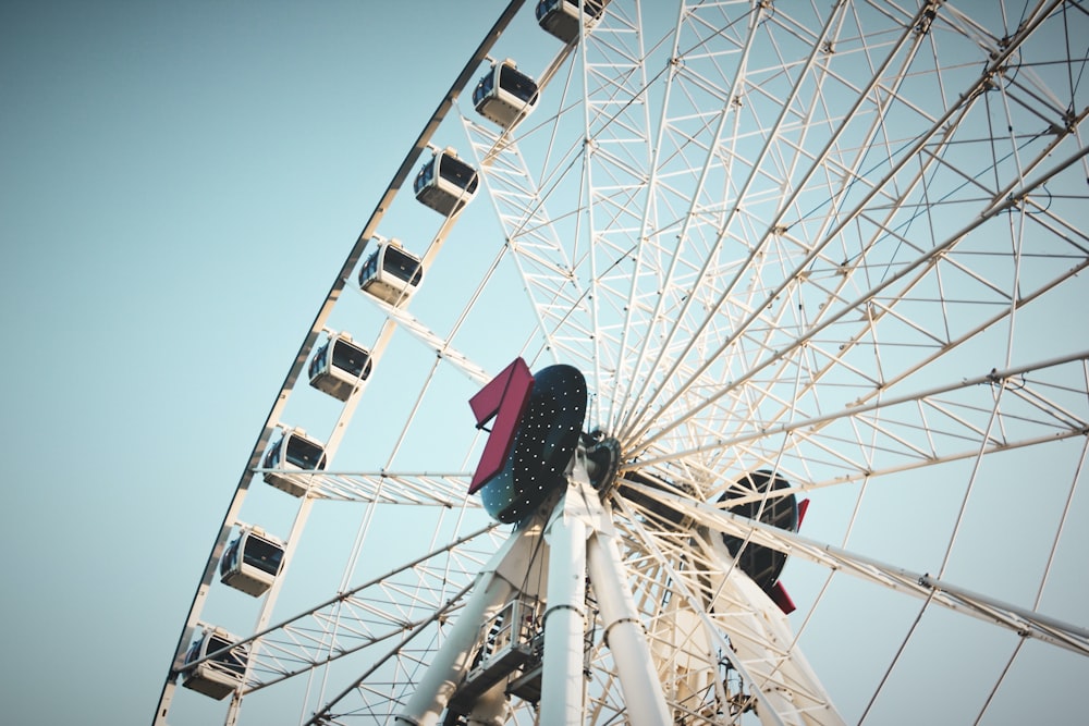 white ferris wheel under blue sky during daytime