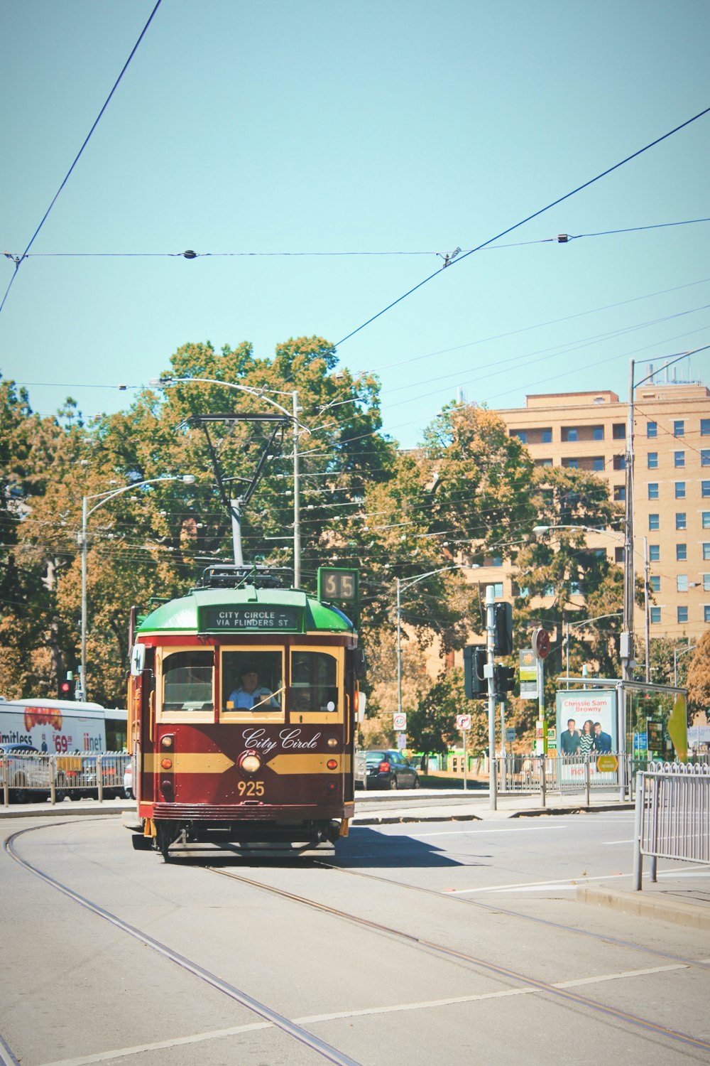yellow and red tram on road during daytime