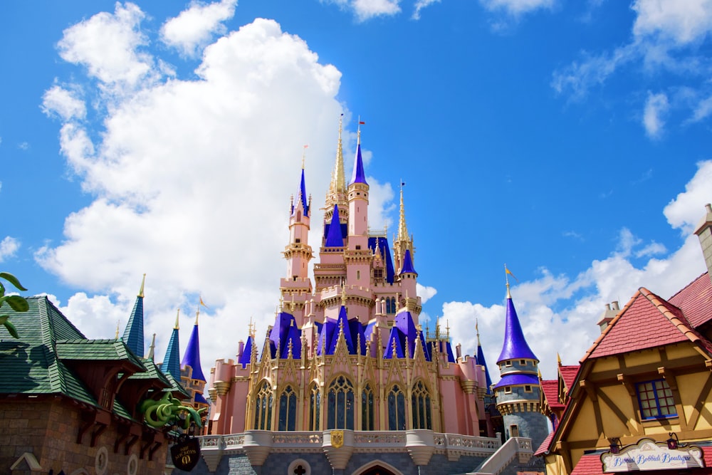 purple and white castle under blue sky