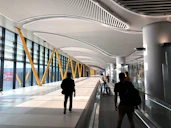 people walking on white tiled floor