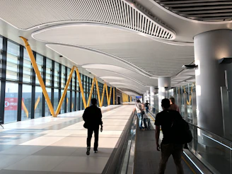 people walking on white tiled floor