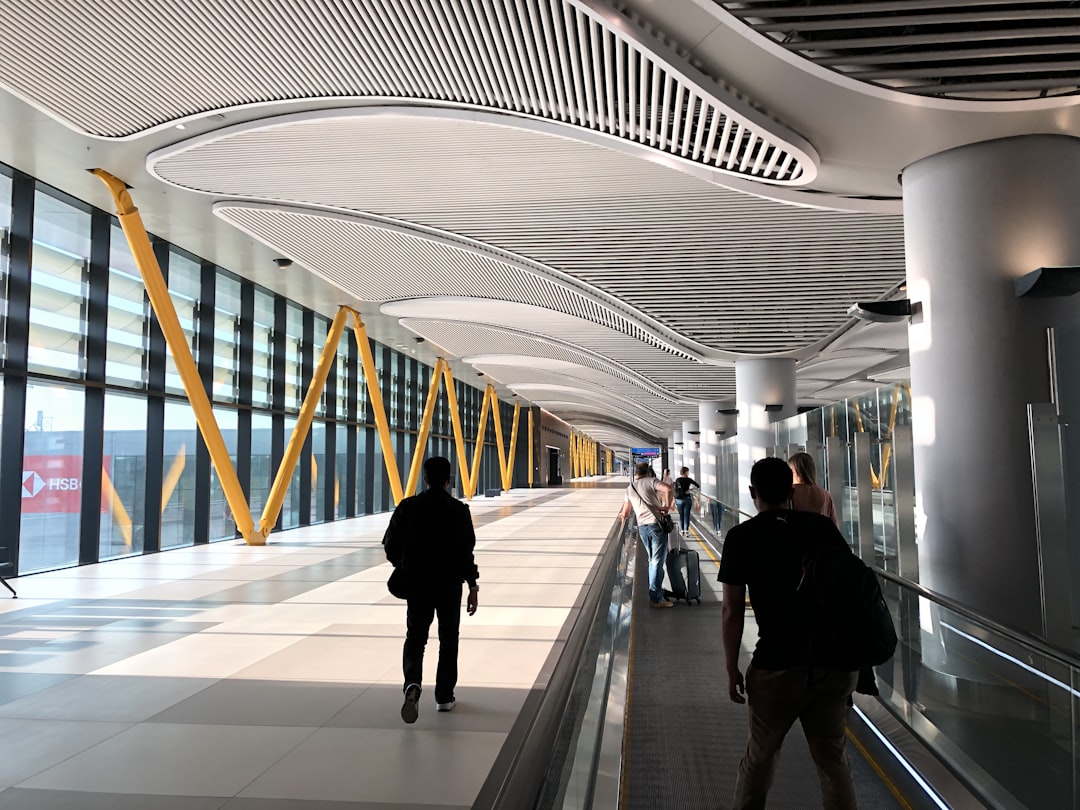 people walking on white tiled floor, AirPort İstanbul Turkey