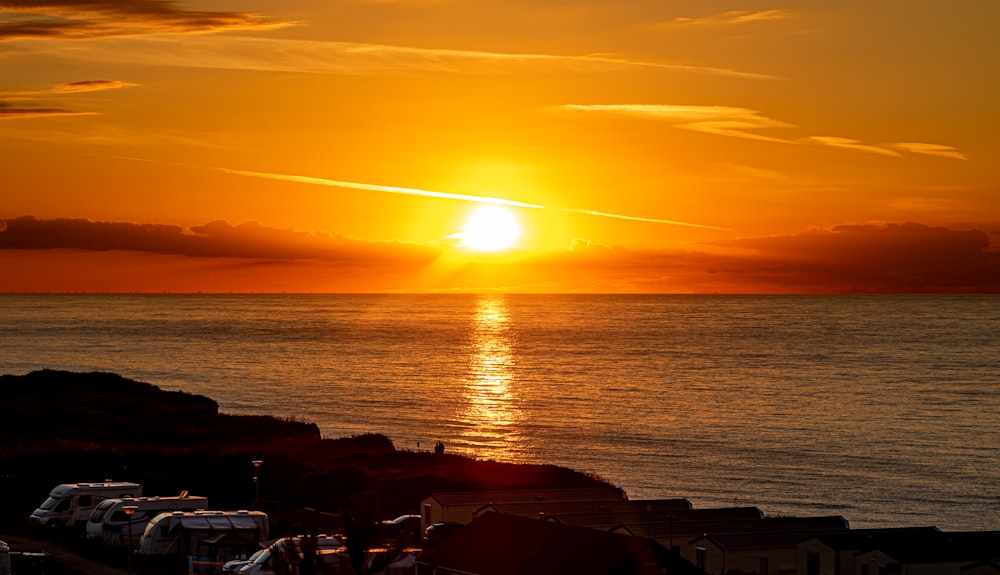 silhouette of people on beach during sunset