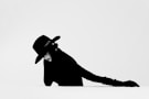 silhouette of a person wearing cowboy hat