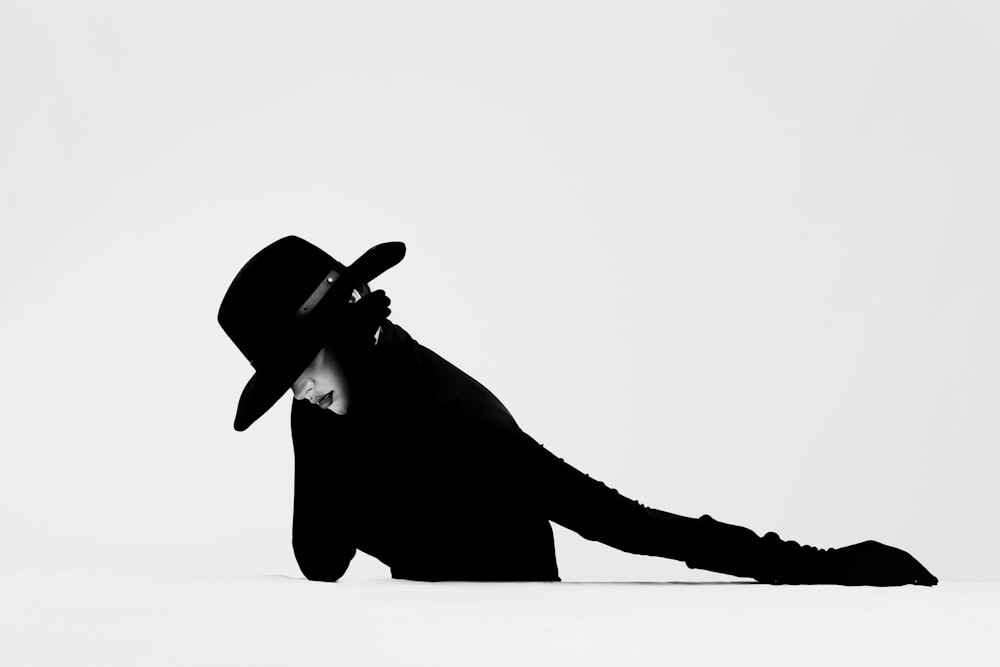 silhouette of a person wearing cowboy hat