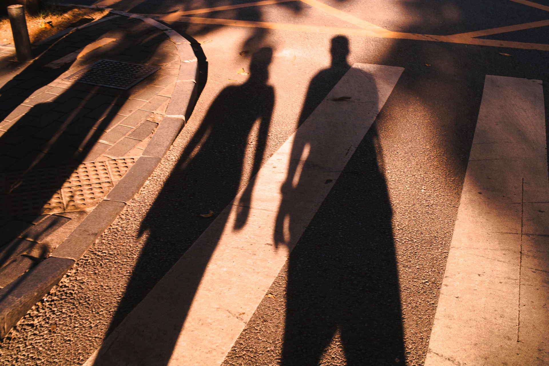 A candid street scene capturing a moment of connection between two strangers under soft morning light.