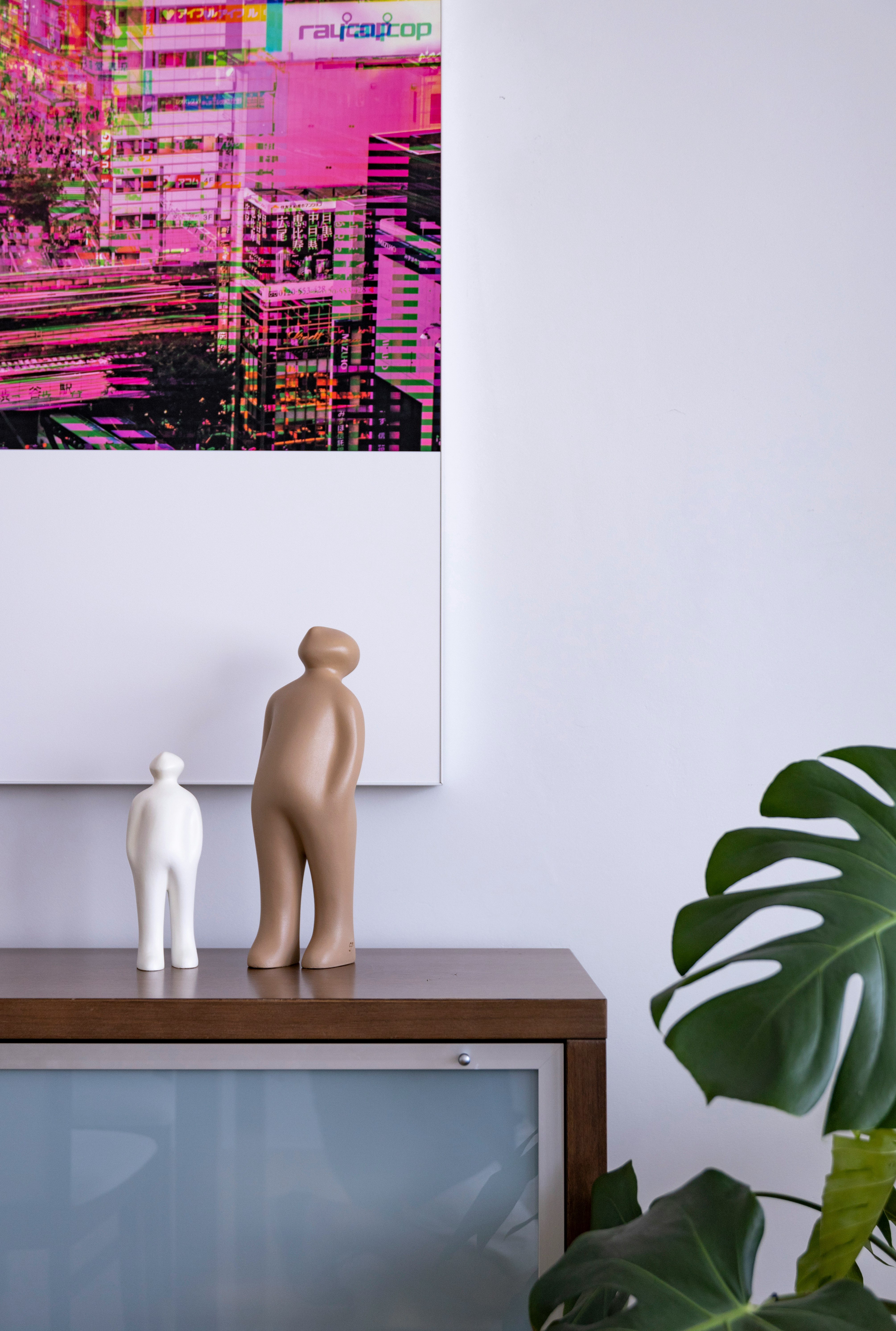 white ceramic figurine on brown wooden table