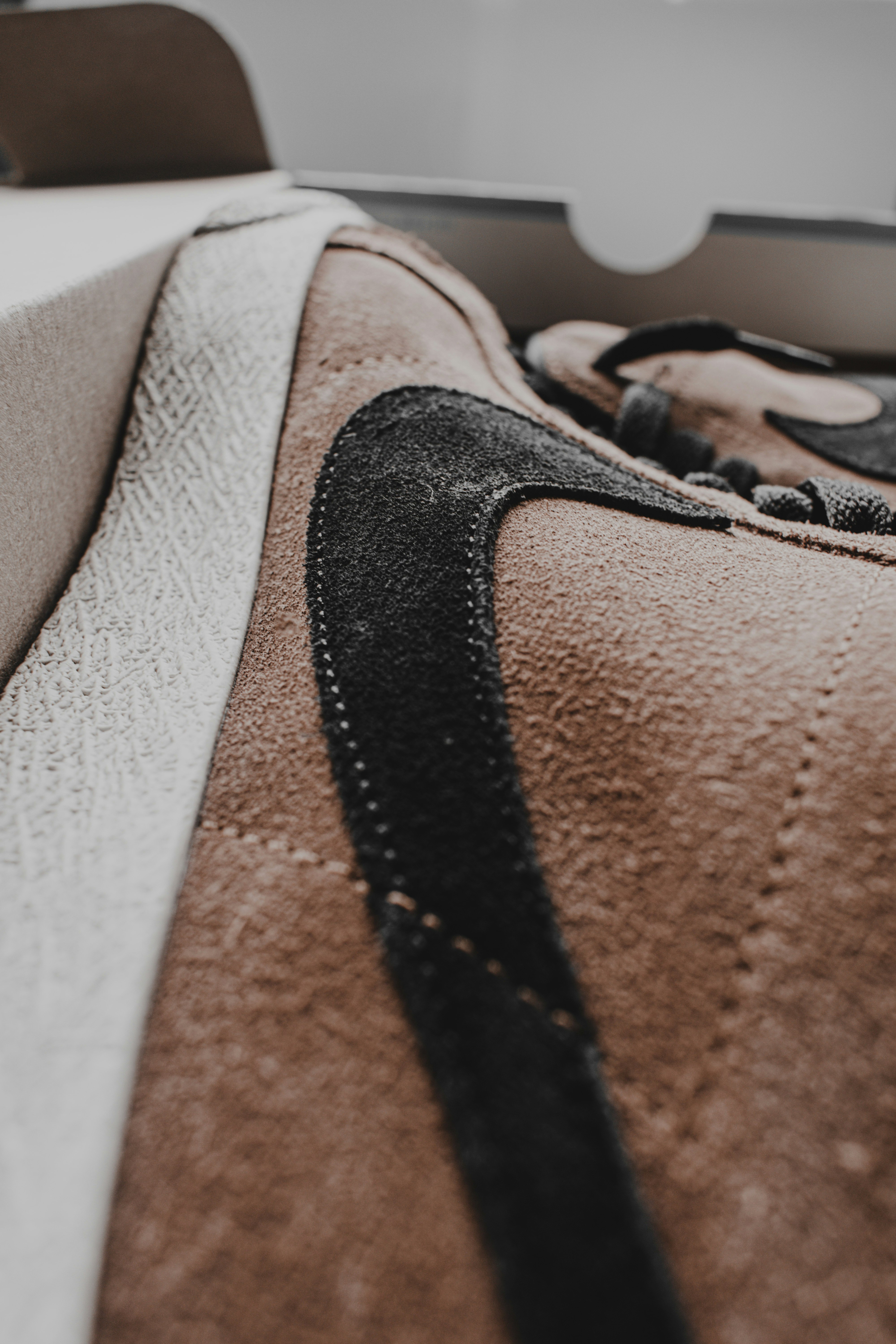 black and brown textile on white textile