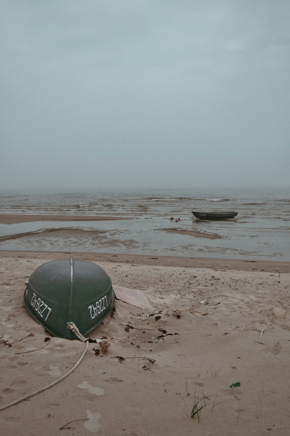 green and white beach ball on beach shore during daytime