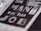 Close-up of text reading 'The Man For The Job' in bold, prominent letters on a textured surface, suggesting a vintage or classic style.