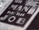 Close-up of text reading 'The Man For The Job' in bold, prominent letters on a textured surface, suggesting a vintage or classic style.