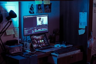 black flat screen computer monitor turned on near black computer keyboard