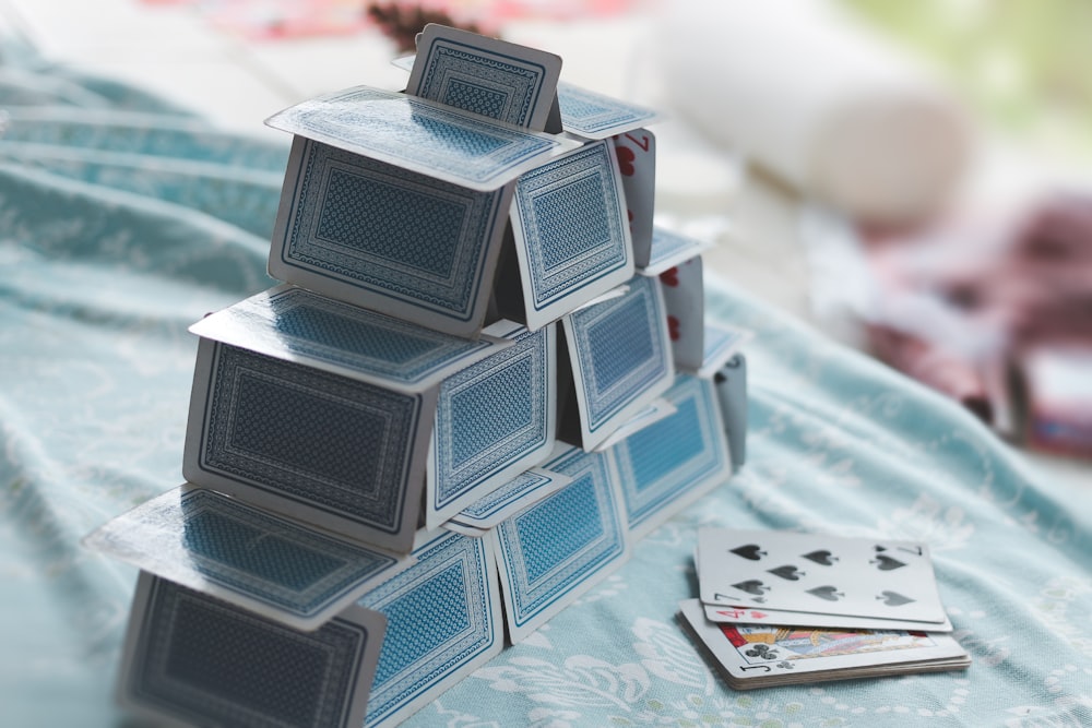 white and blue game cards on blue and white table