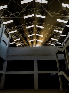 Sunlight filtering through the warehouse windows highlighting aluminum pieces