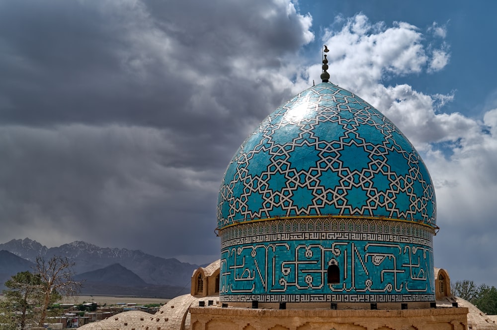 green and white dome building under cloudy sky during daytime