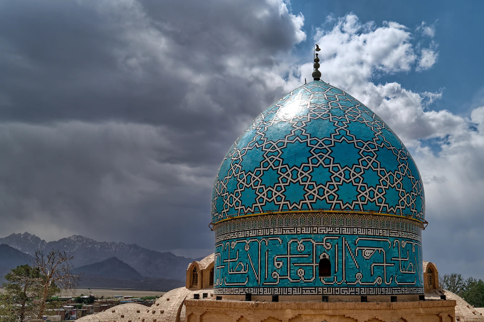 The turquoise dome of the Shah Nematollah Vali shrine at Mahan — Kerman, Iran