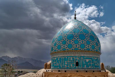 The turquoise dome of the Shah Nematollah Vali shrine at Mahan — Kerman, Iran