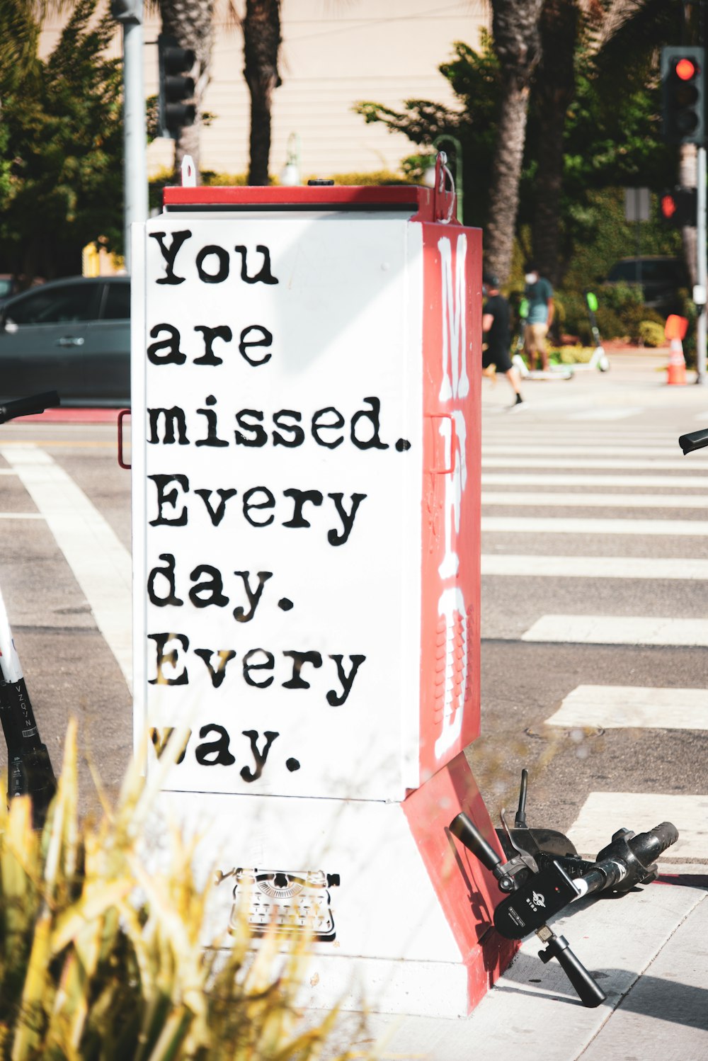 white and red street sign