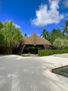 An open pavilion with panoramic views of the island’s coastline under a bright tropical sky.