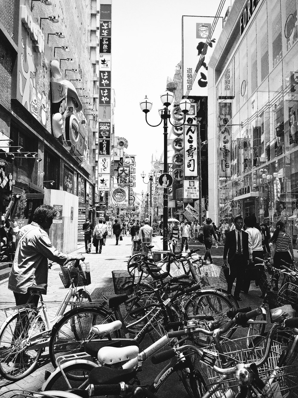 grayscale photo of people walking on street