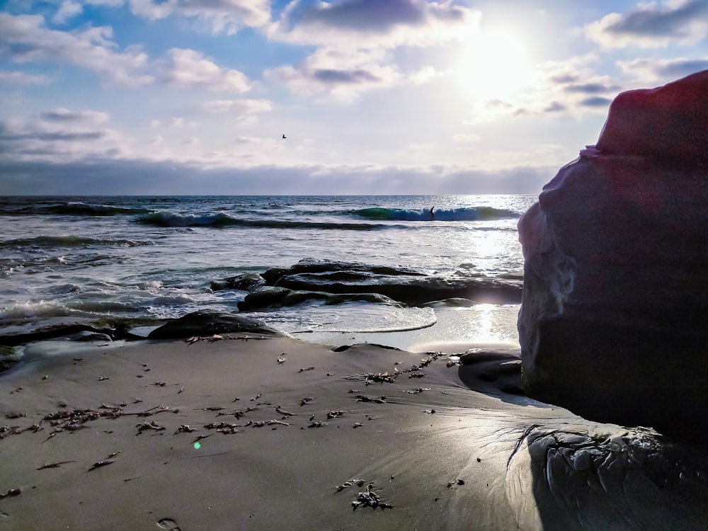 white rock formation on seashore during daytime