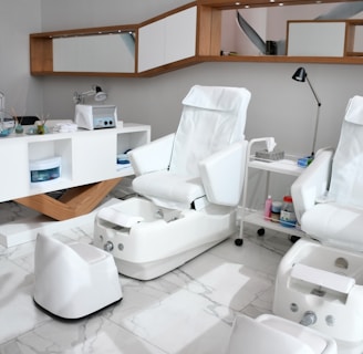 white rolling chairs near brown wooden desk