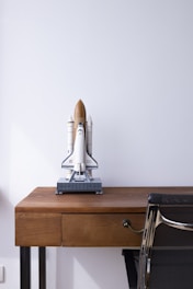 white and brown space ship toy