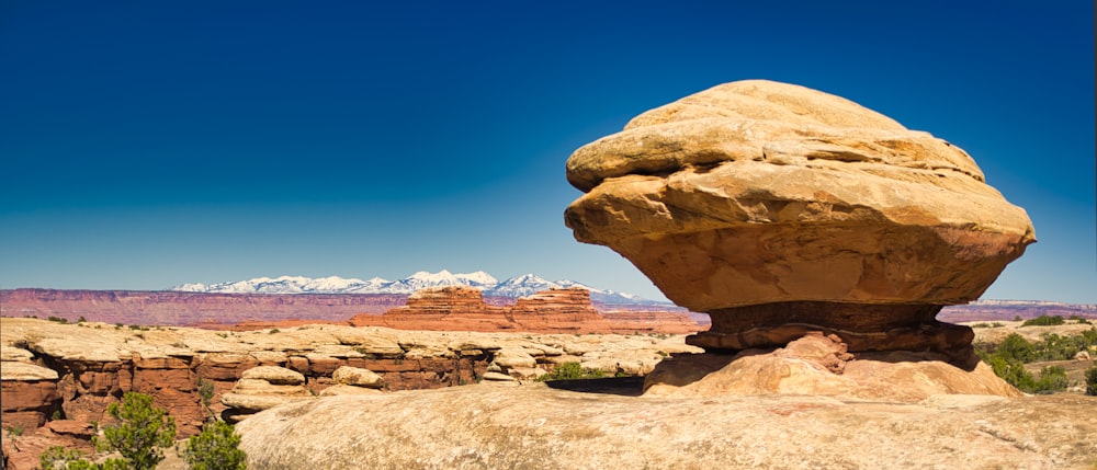 brown rock formation under blue sky during daytime