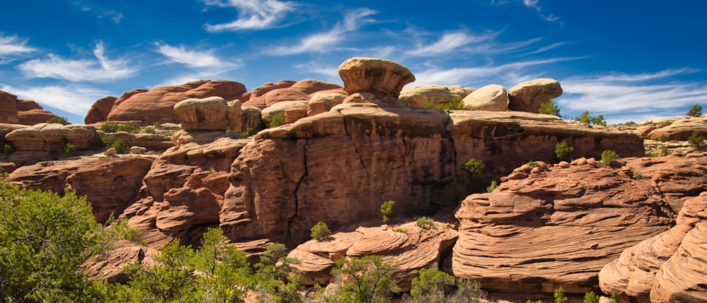 brown rock formation under blue sky during daytime