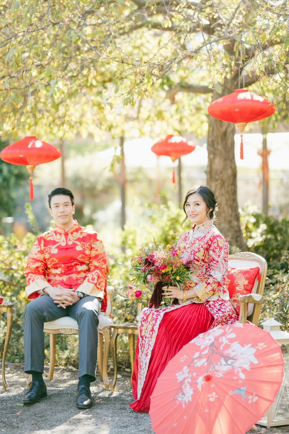 woman in red and white floral dress sitting on chair