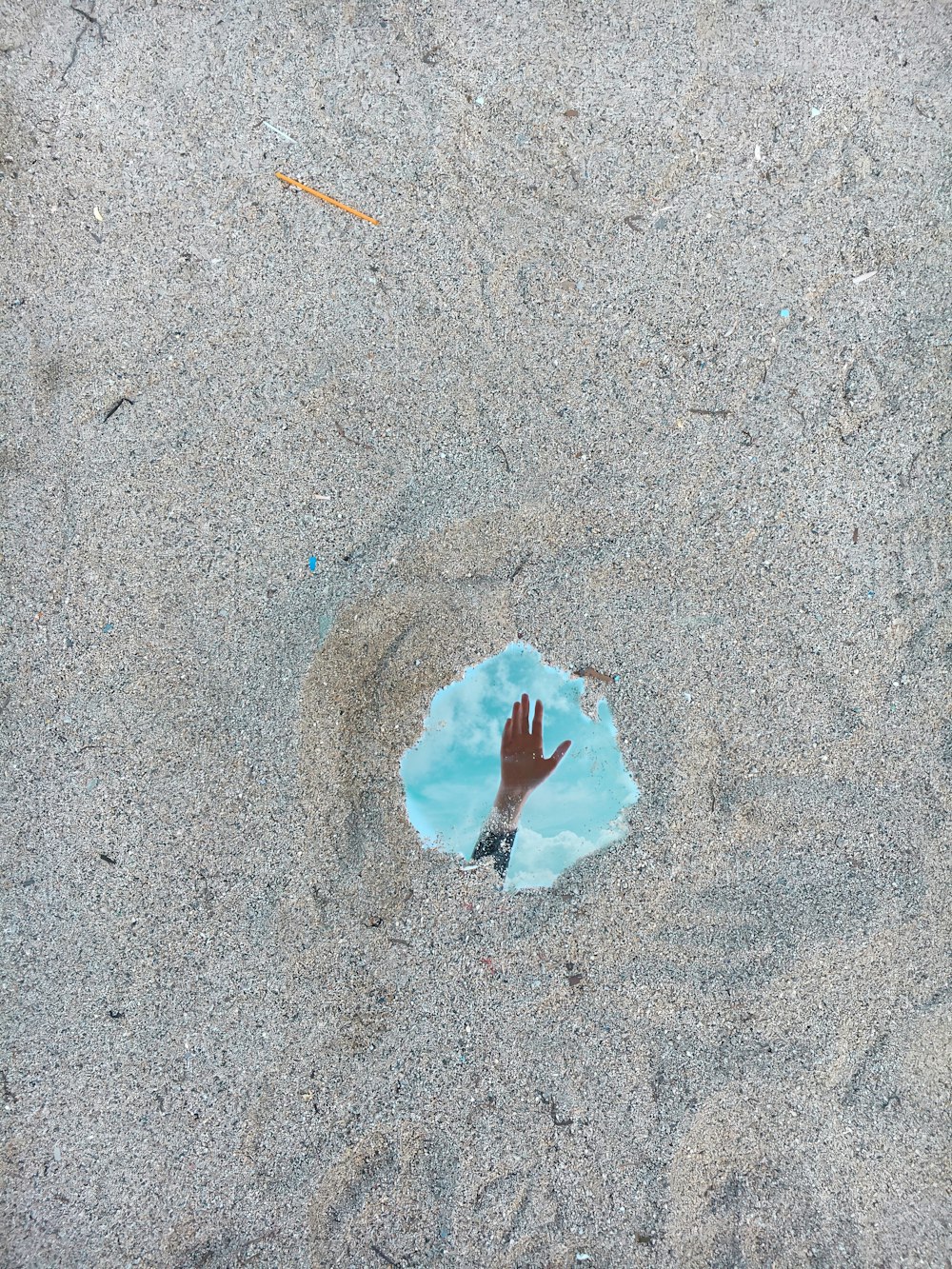 white paper on gray sand