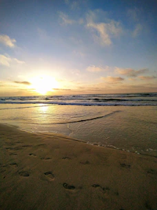 Sunset view over Morro de São Paulo beach with vibrant colors and calm waves