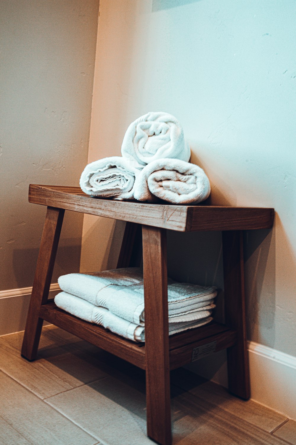 white textile on brown wooden chair