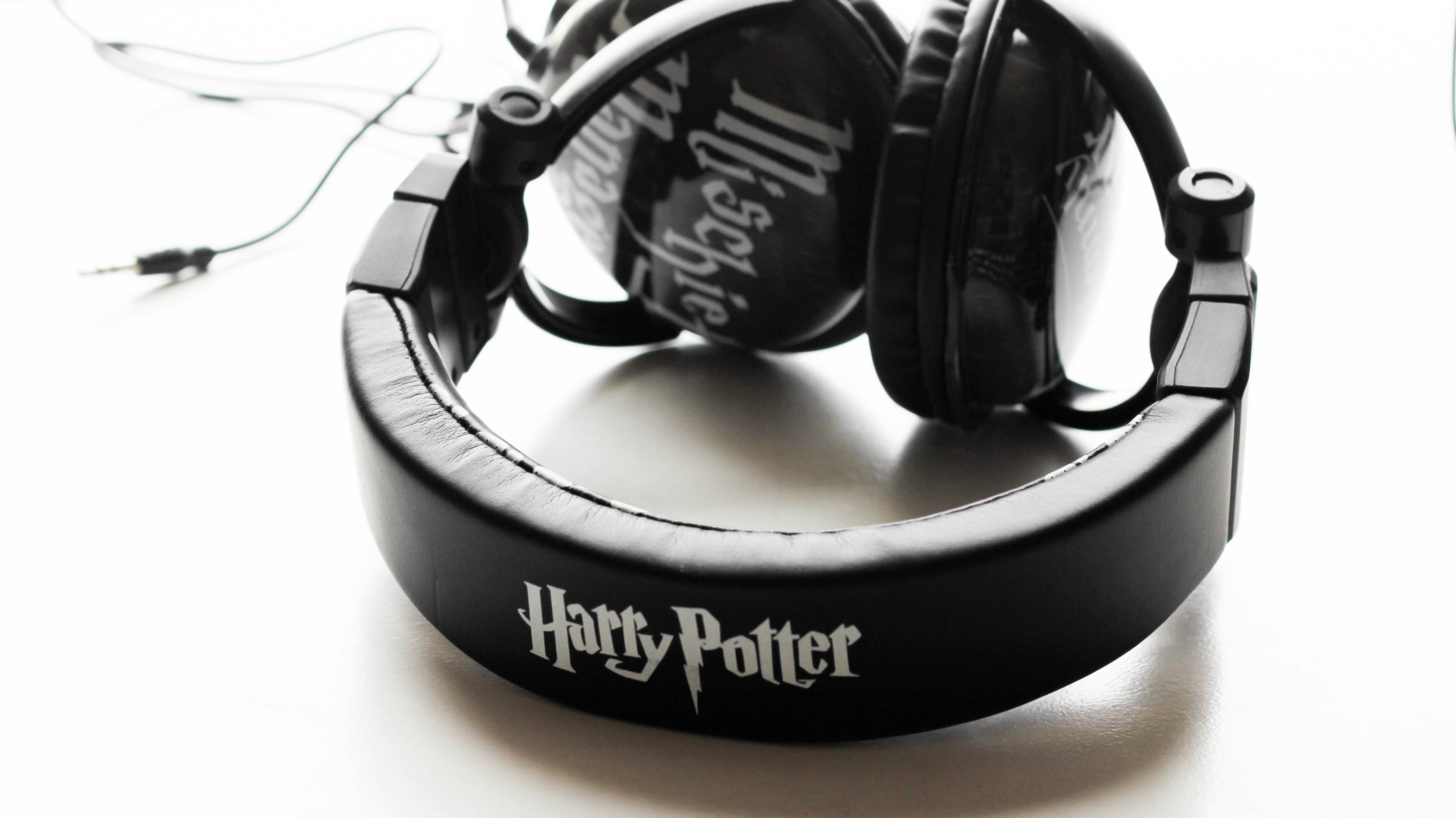 black and silver headphones on white table