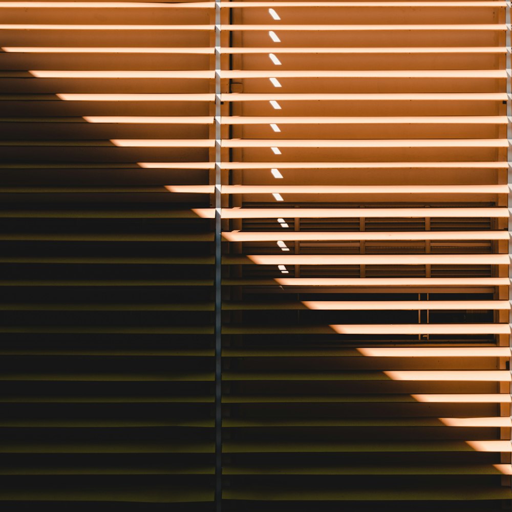 brown window blinds during daytime