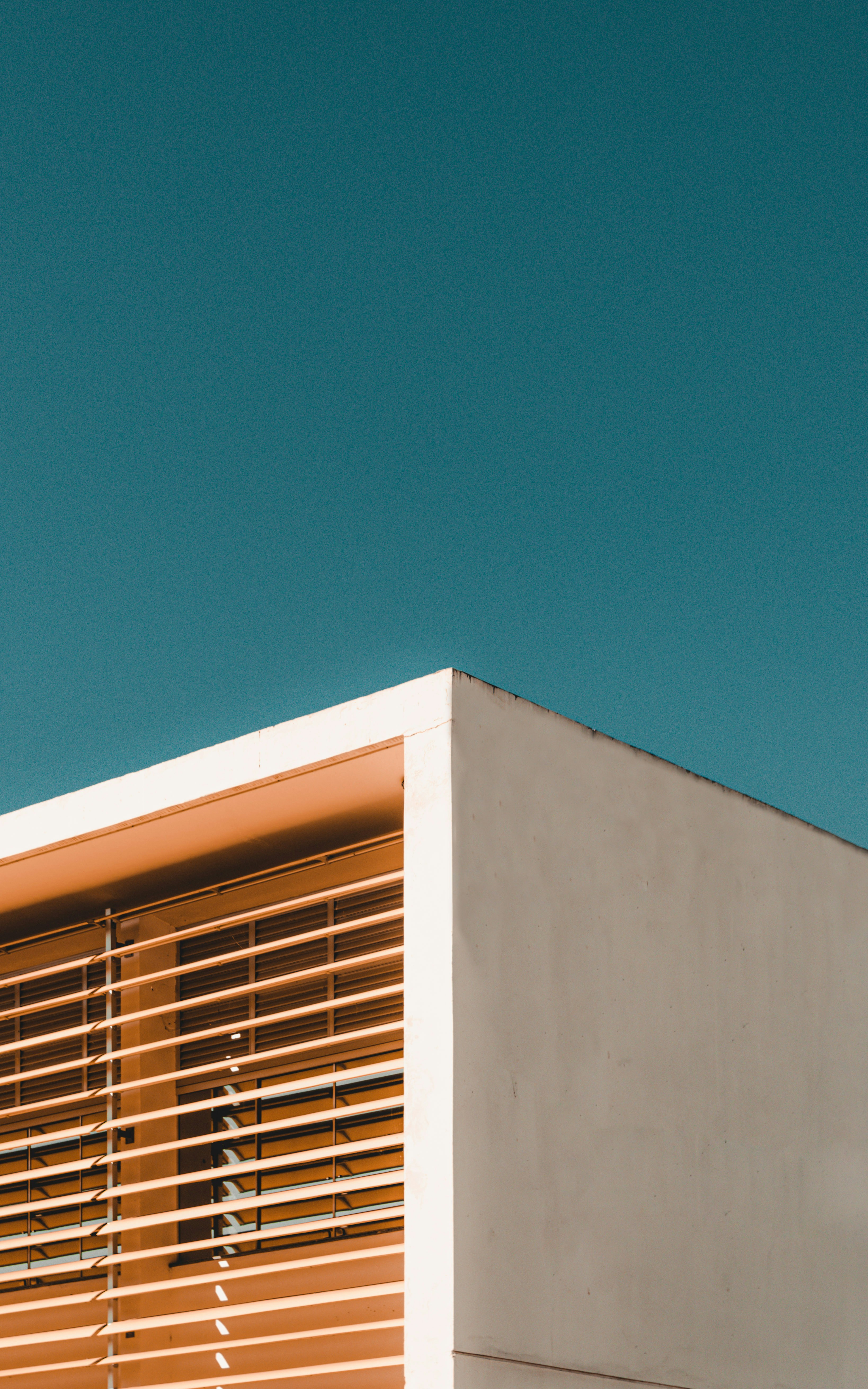 white concrete building under blue sky during daytime
