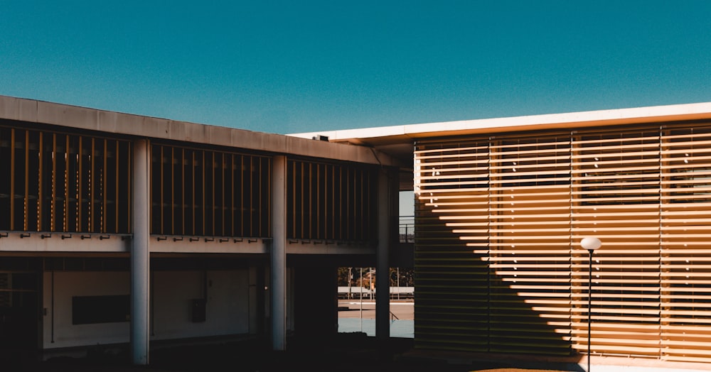 brown and white concrete building under blue sky during daytime