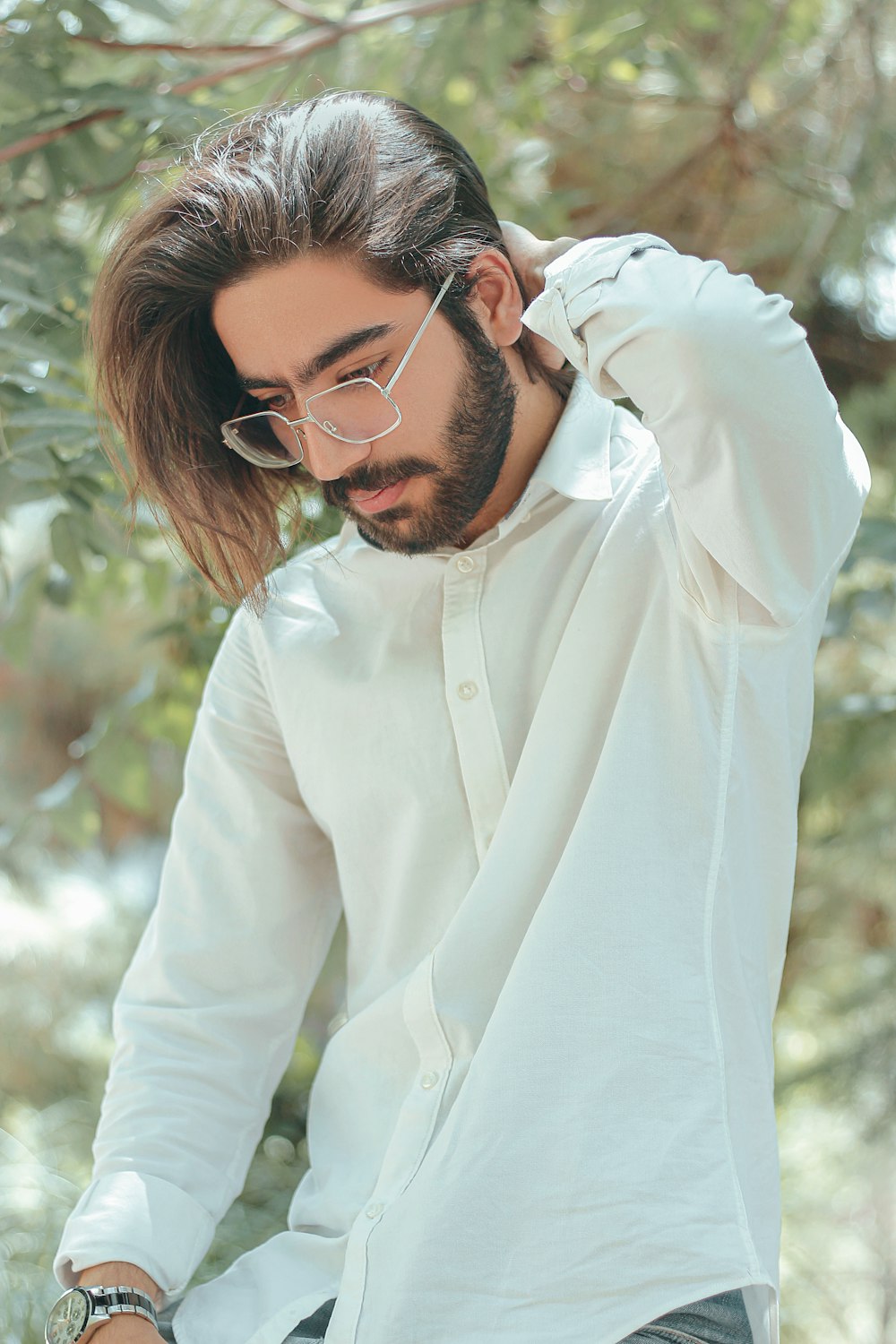 woman in white dress shirt wearing black framed eyeglasses