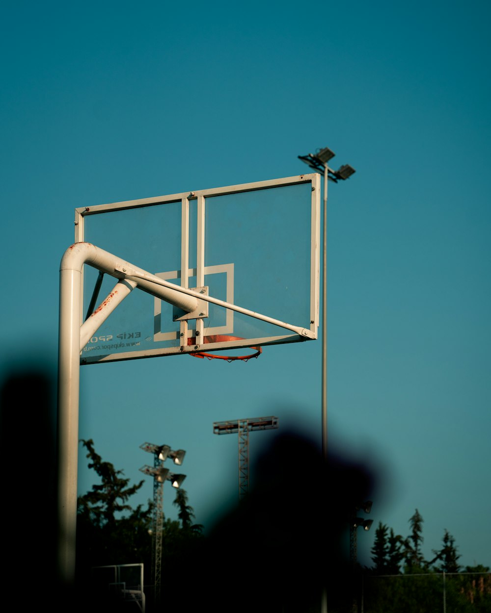 white metal ladder under blue sky