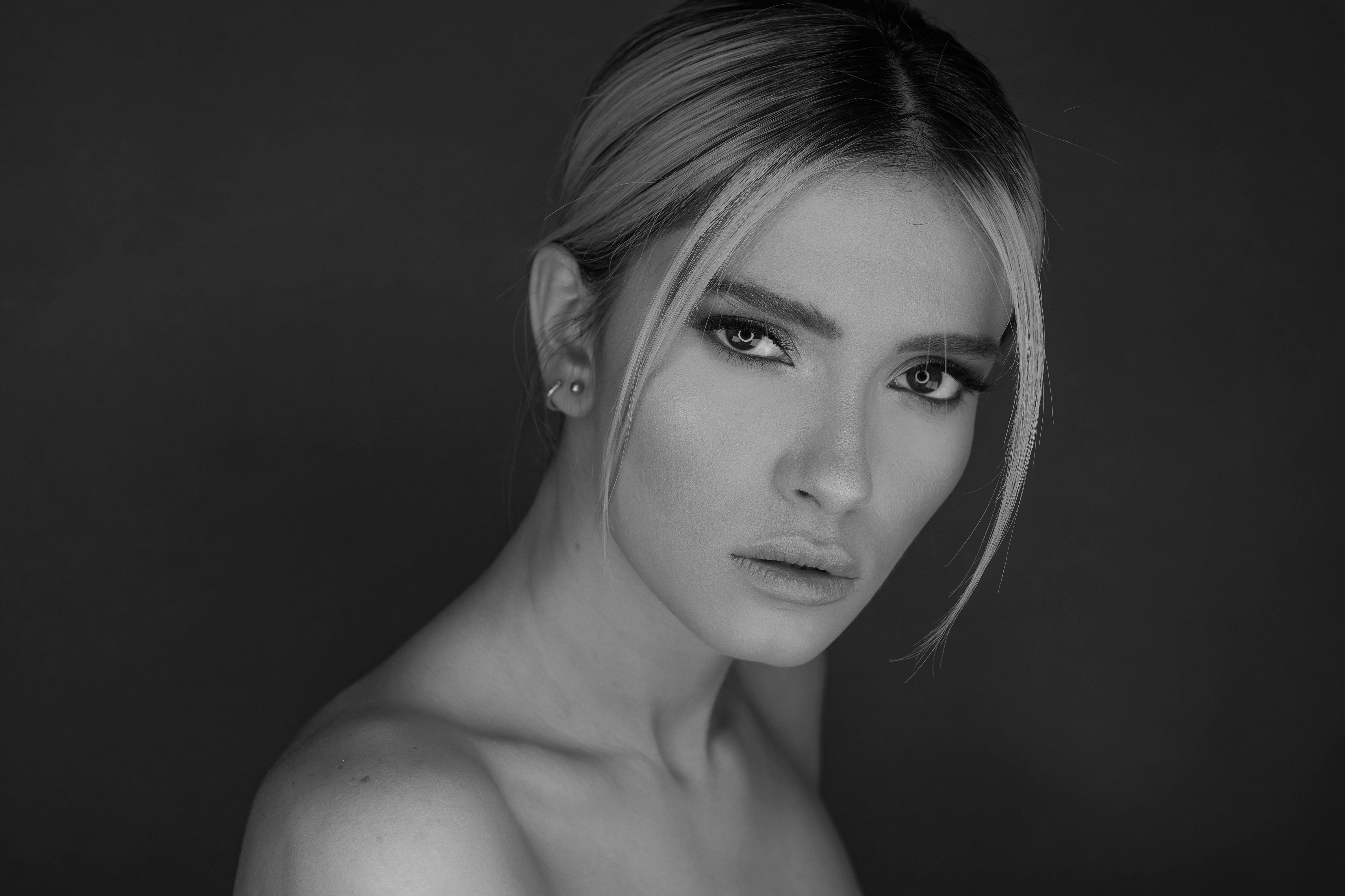 womans face in grayscale