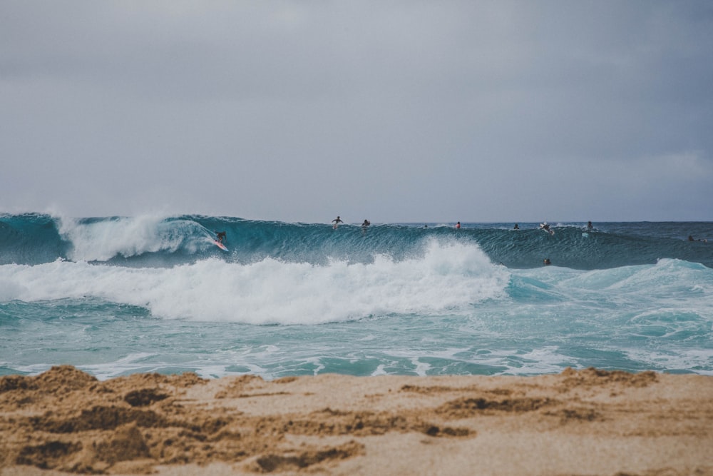 person surfing on sea waves during daytime