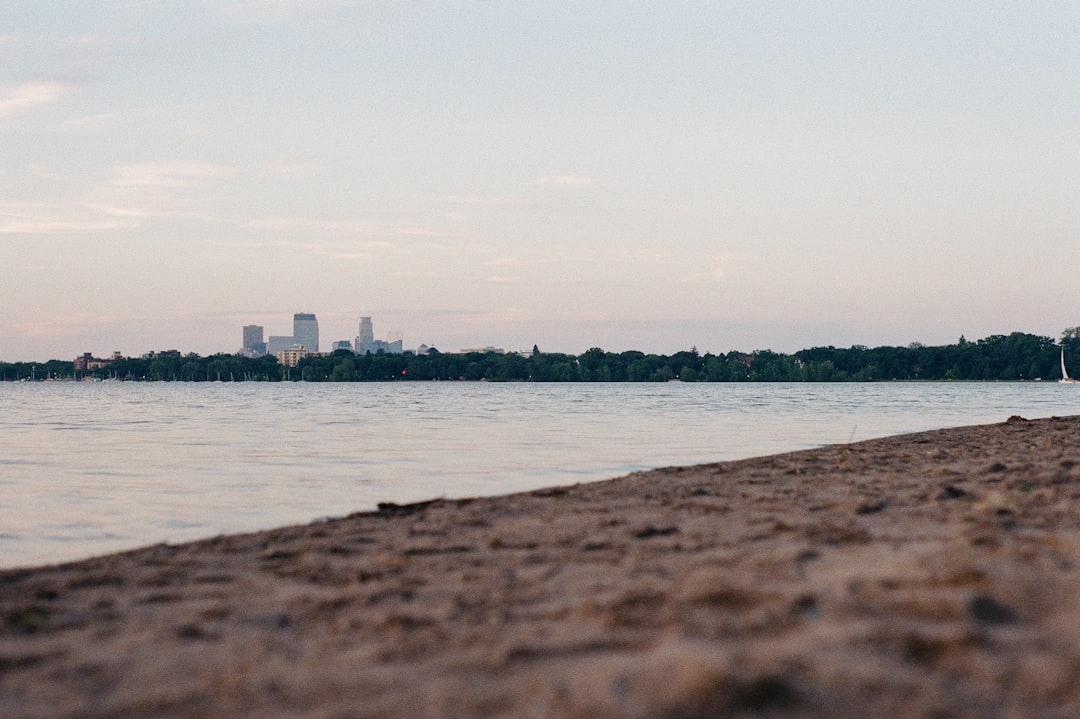 body of water near city buildings during daytime