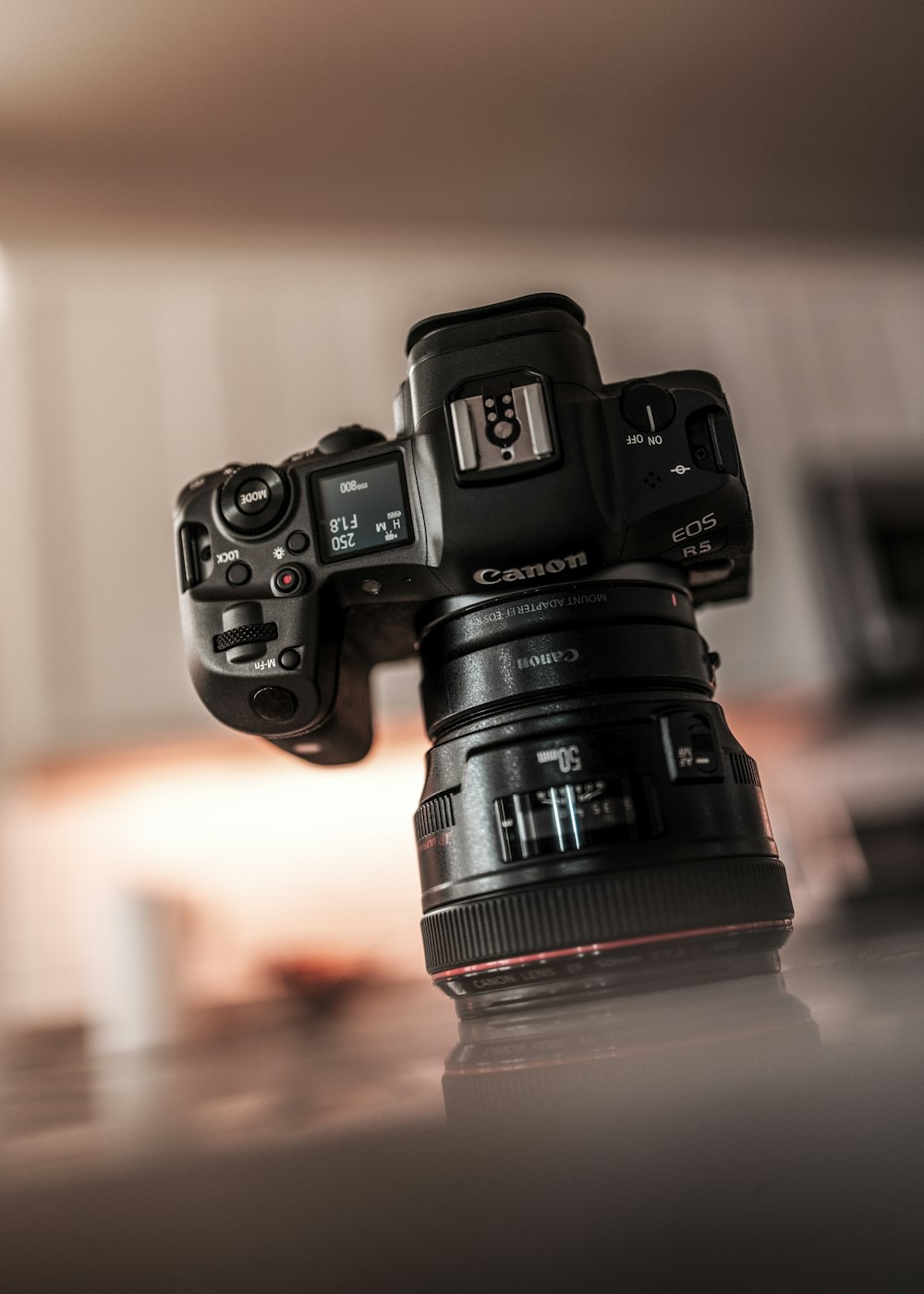 black nikon dslr camera on brown wooden table