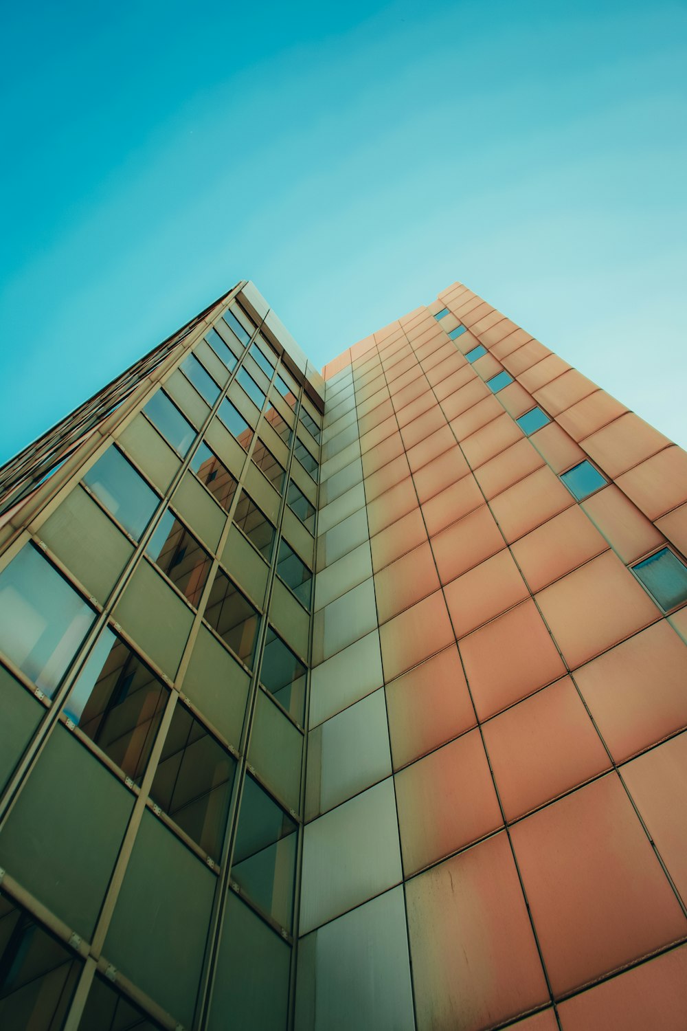 brown and white concrete building under blue sky during daytime