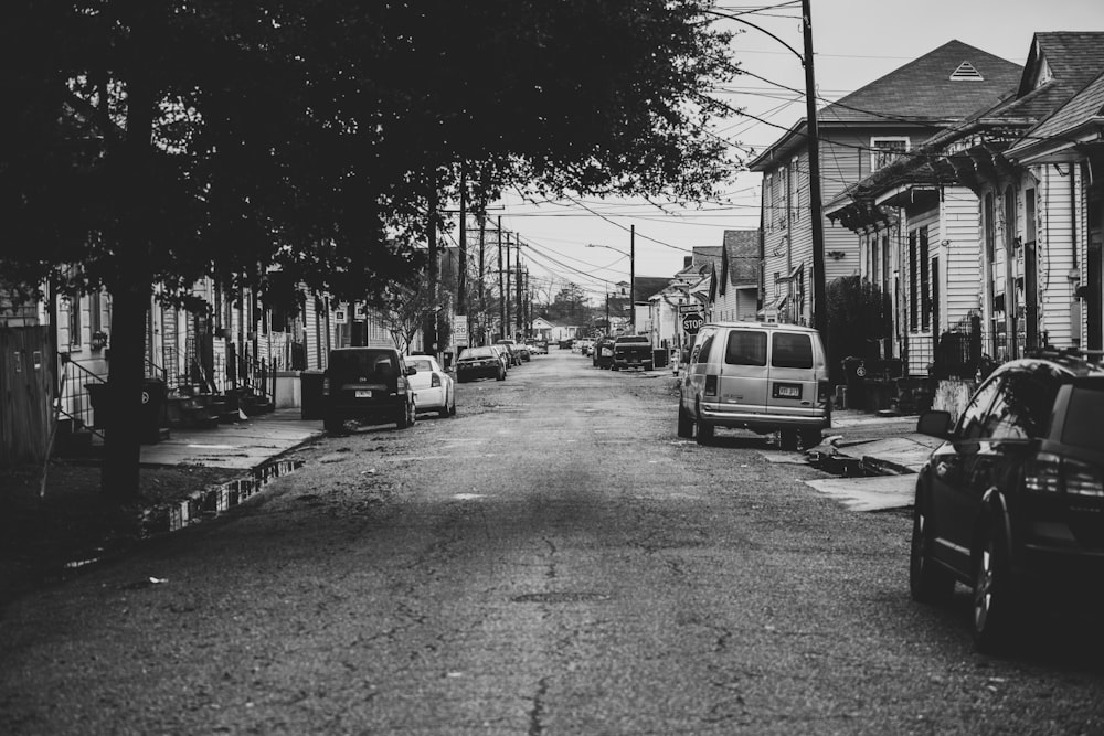 grayscale photo of cars on road