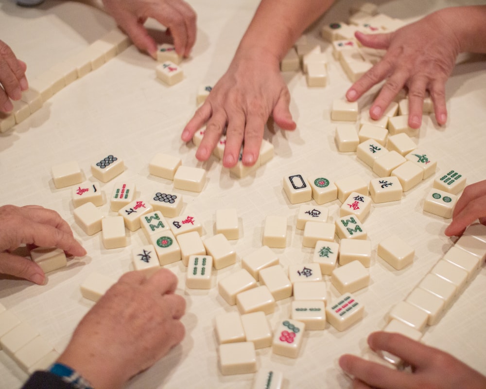 person playing white and brown lego blocks